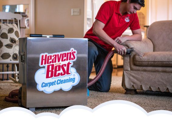 Man cleaning the sofa in the living room - Ottumwa, IA - Heaven's Best Ottumwa, IA