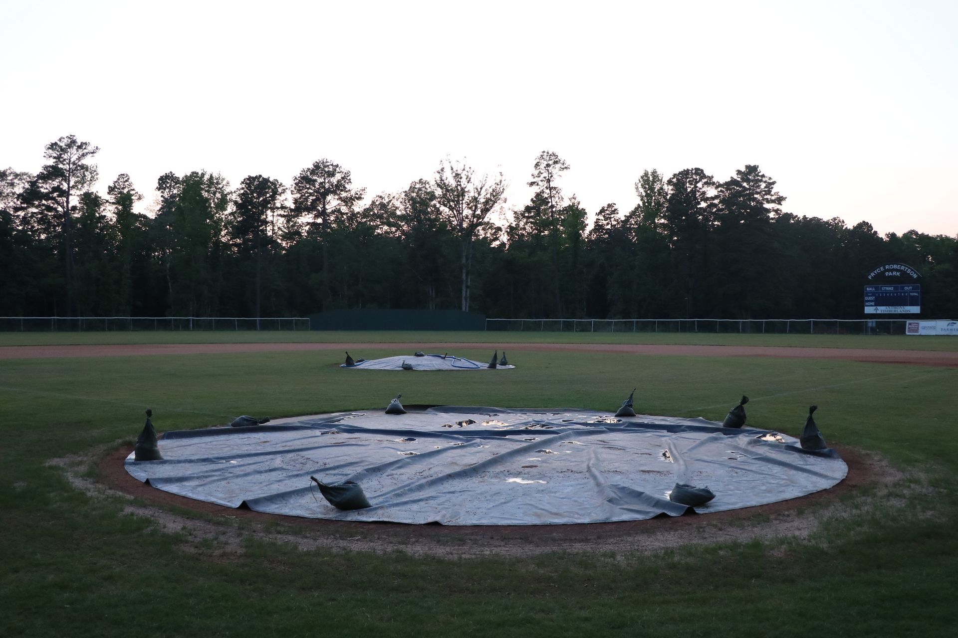 A baseball field with a circle in the middle of it