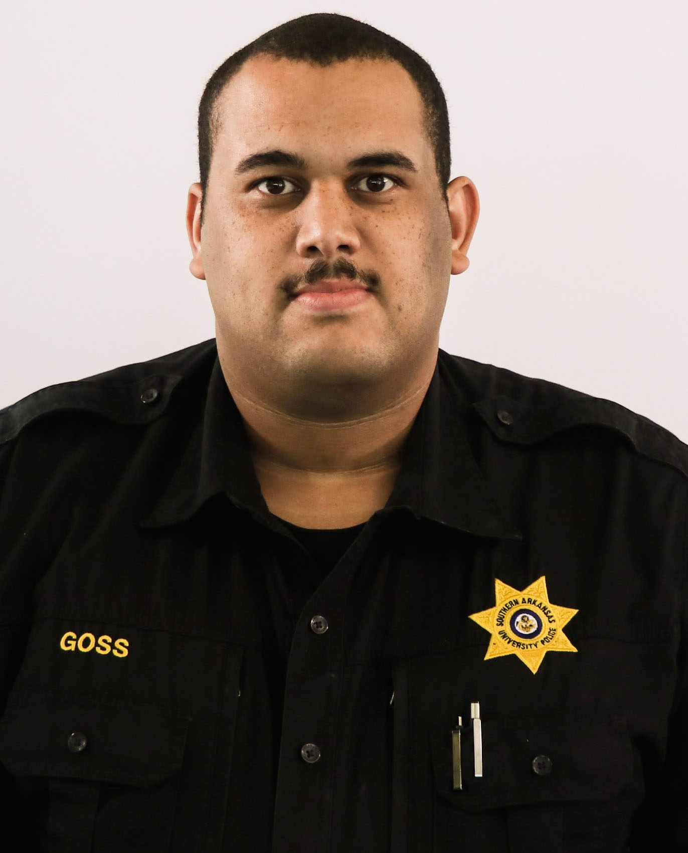 A man with the name goss on his shirt