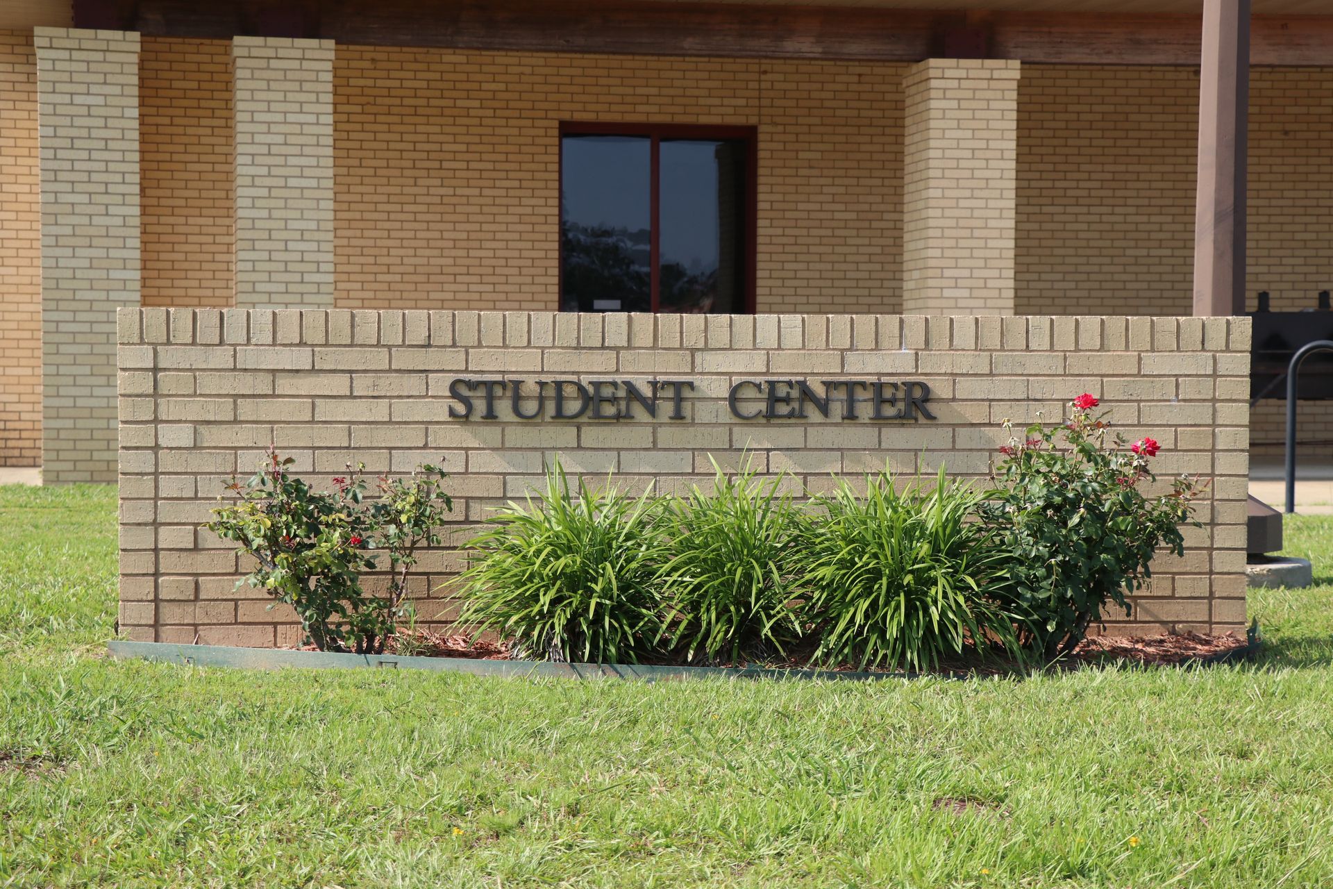 A brick wall with the words student center written on it