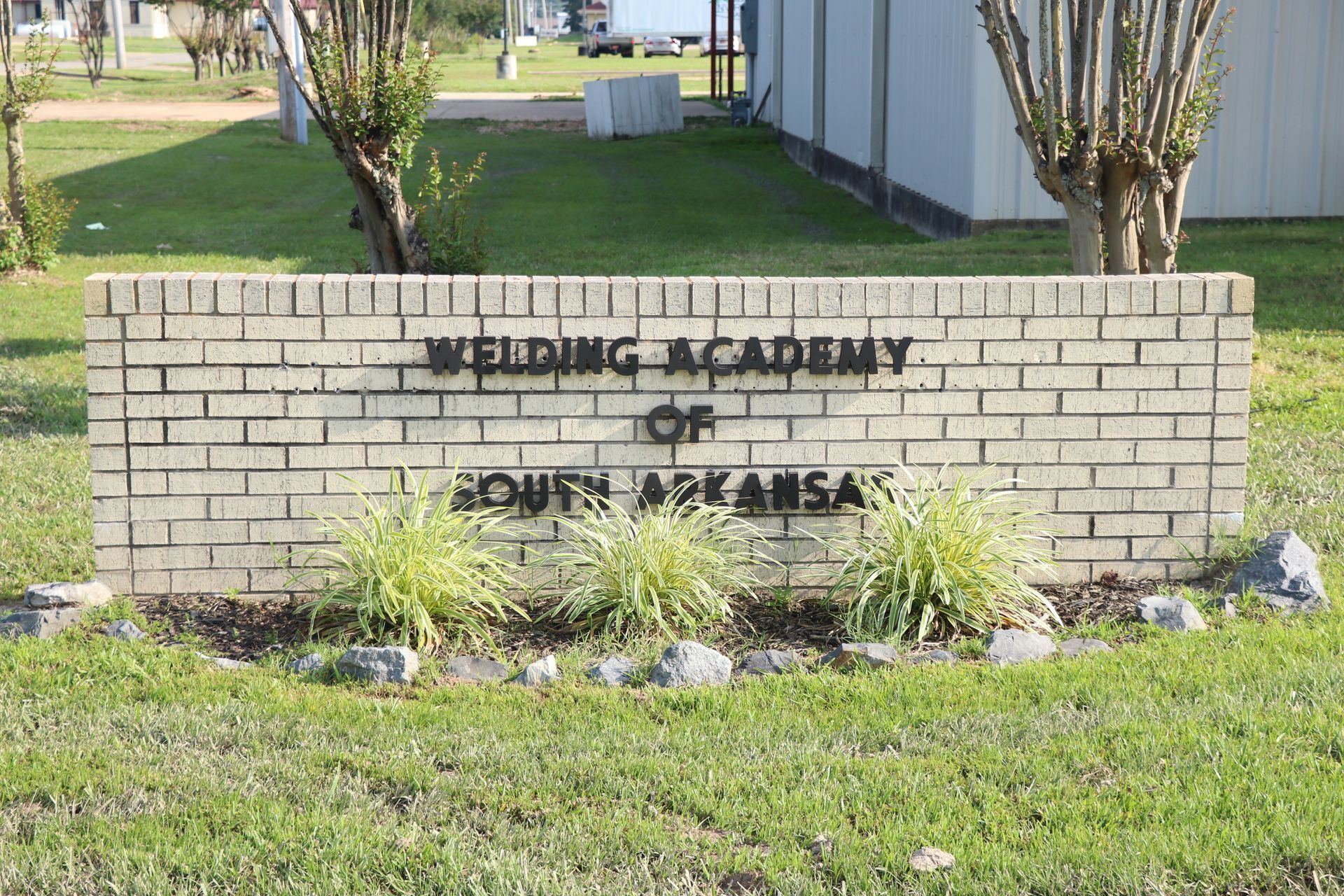 A brick sign for the wedding academy of south arkansas