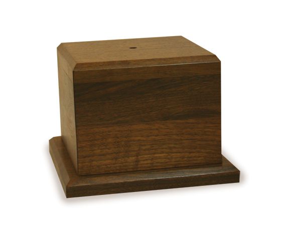 A square wooden box with a hole in the middle