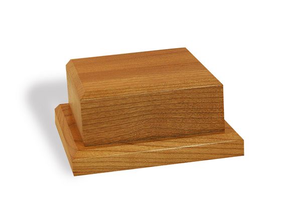 Two wooden blocks are stacked on top of each other on a white background