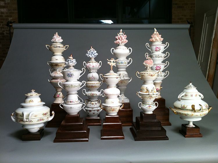 A group of trophies are stacked on top of each other