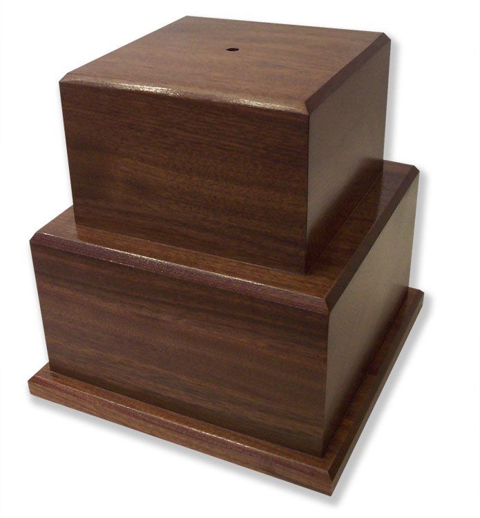 Two wooden boxes are stacked on top of each other