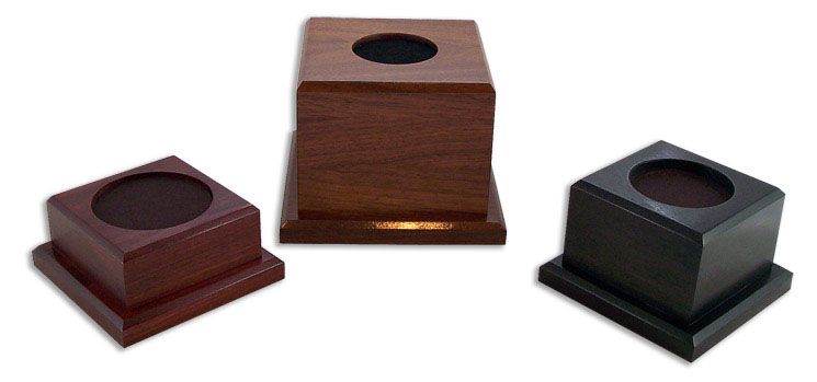 Three square wooden boxes with a hole in the middle