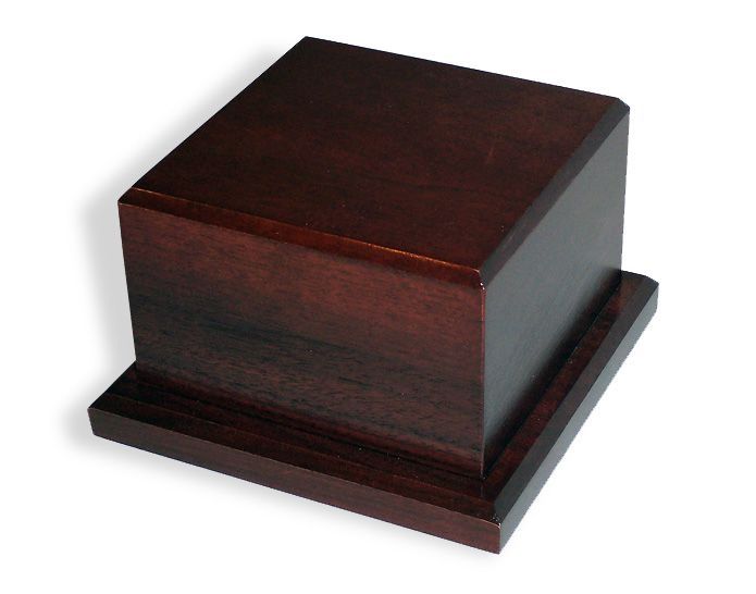 A small square wooden box on a white background