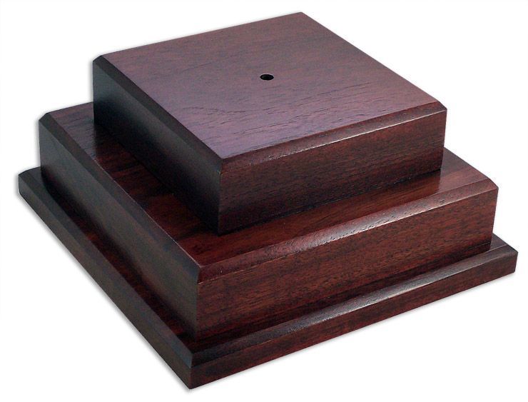 Two square wooden boxes are stacked on top of each other