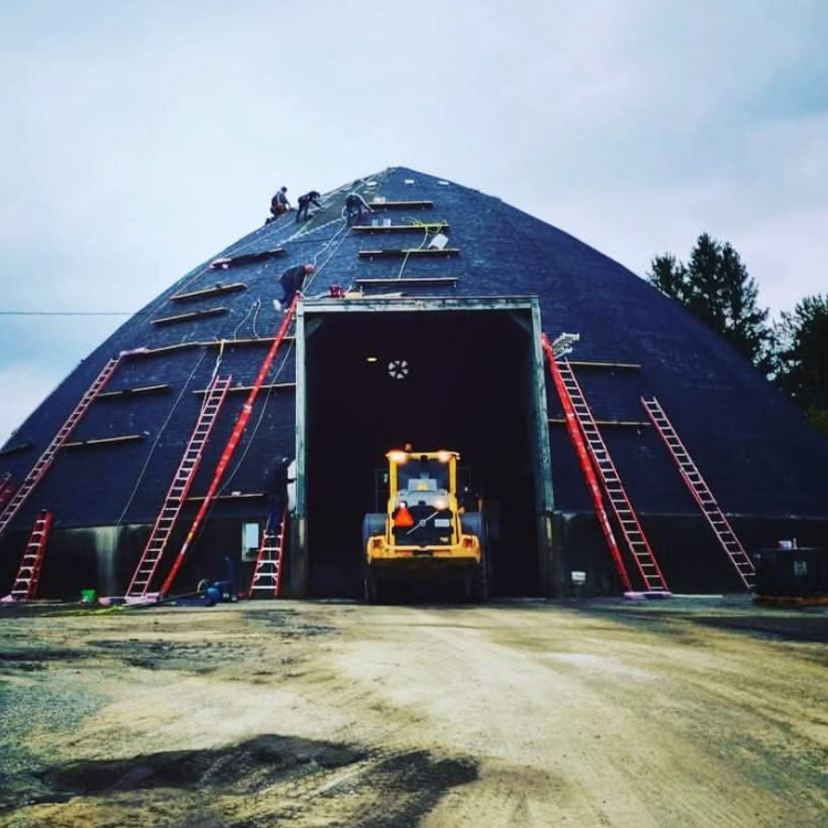 A large dome with a tractor inside of it