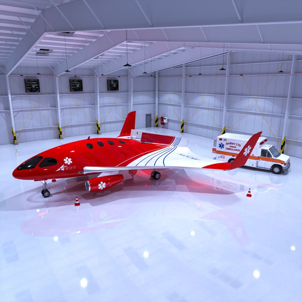 Red and white jet in a hangar with an ambulance.