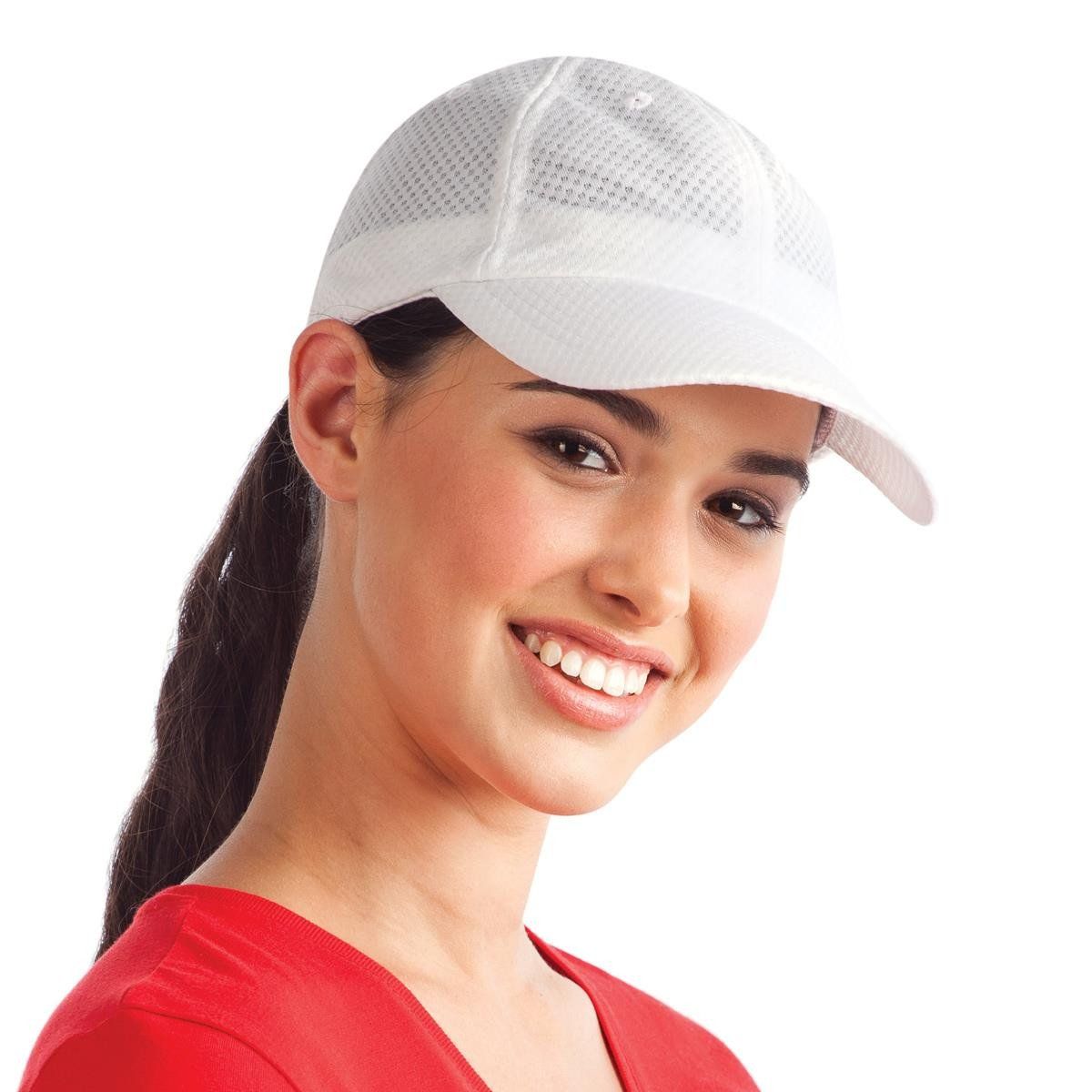 A woman wearing a red shirt and a white hat smiles
