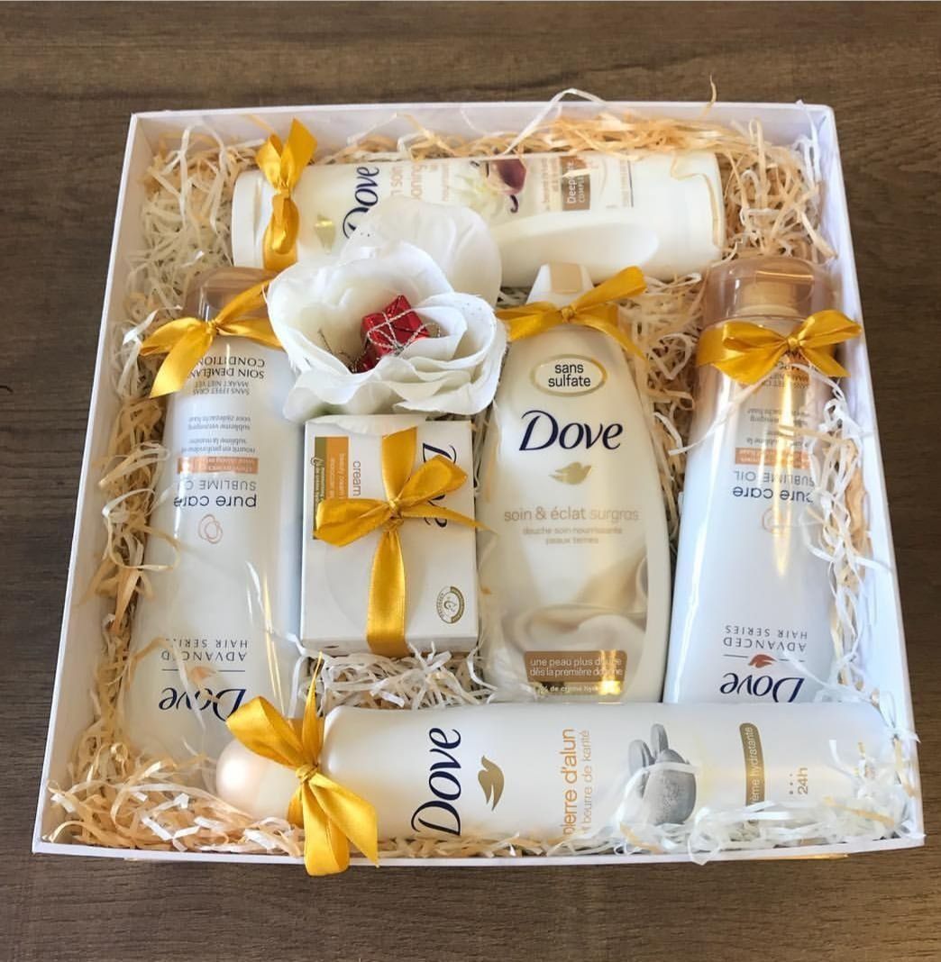 A box filled with dove products and flowers