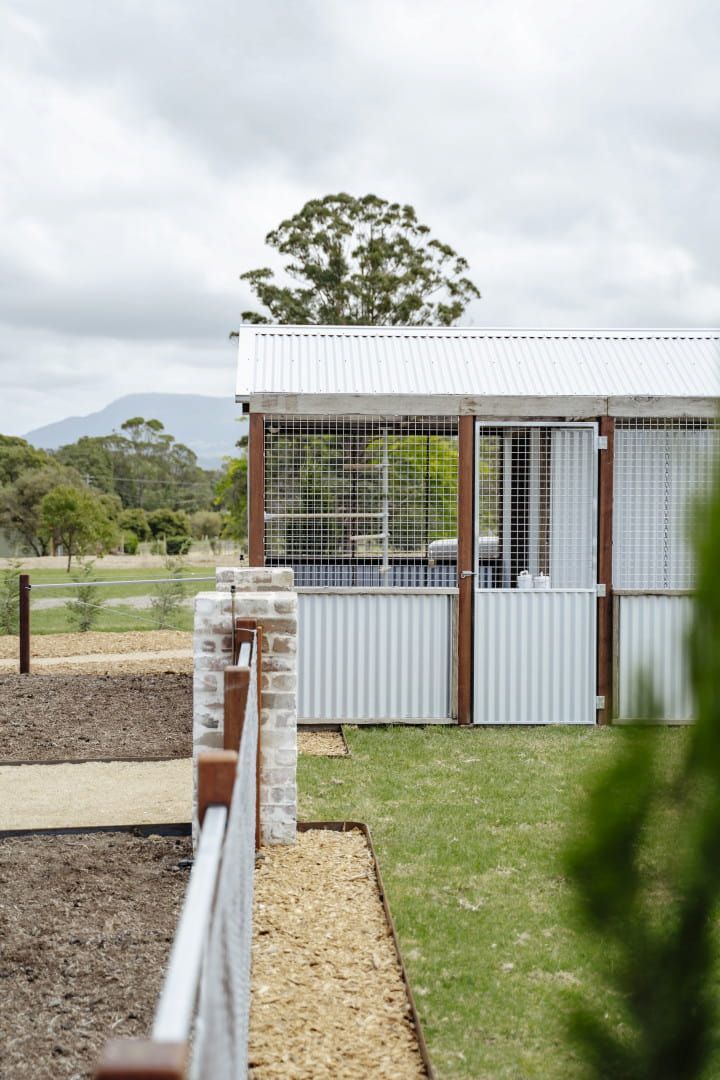 A Modern, White Building With a Corrugated Metal Roof — Stark Building & Constructions In Berry, NSW