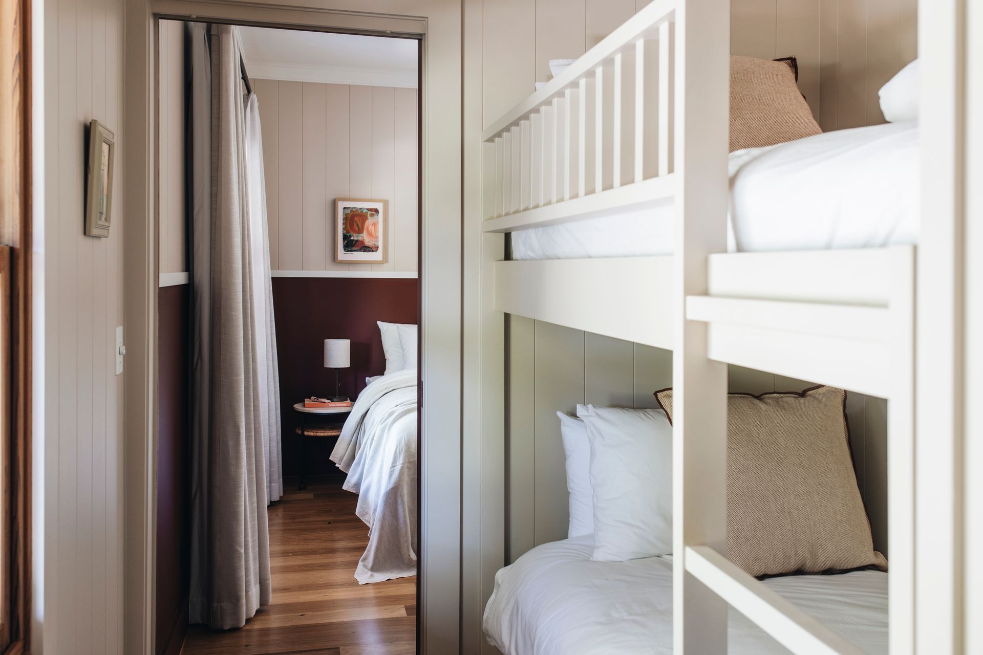 Bunk beds in a room, viewed from a hallway leading to a bedroom — Stark Building & Constructions In Berry, NSW