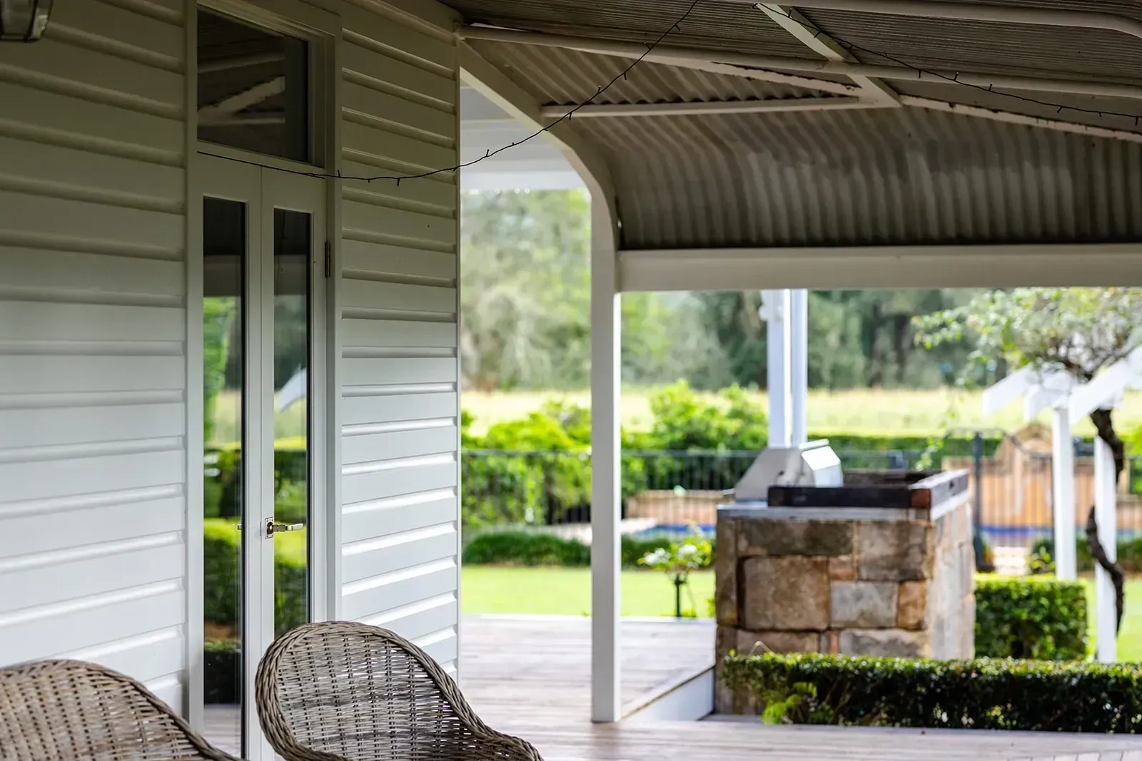 Exterior View of a House With a Covered Patio Overlooking a Grassy Yard — Stark Building & Constructions In Berry, NSW