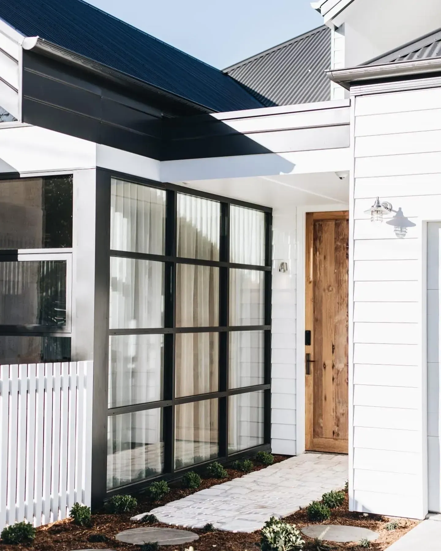 Modern Home Entrance With a Black-framed Glass Window — Stark Building & Constructions In Berry, NSW