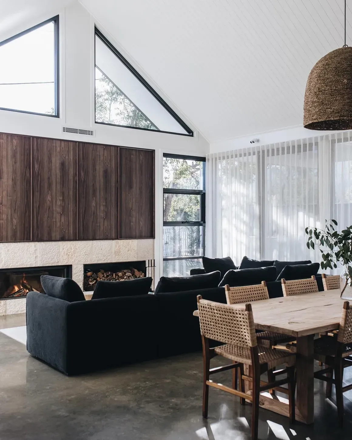 Modern Living Room With Dark Sofa, Wood-paneled Wall — Stark Building & Constructions In Berry, NSW