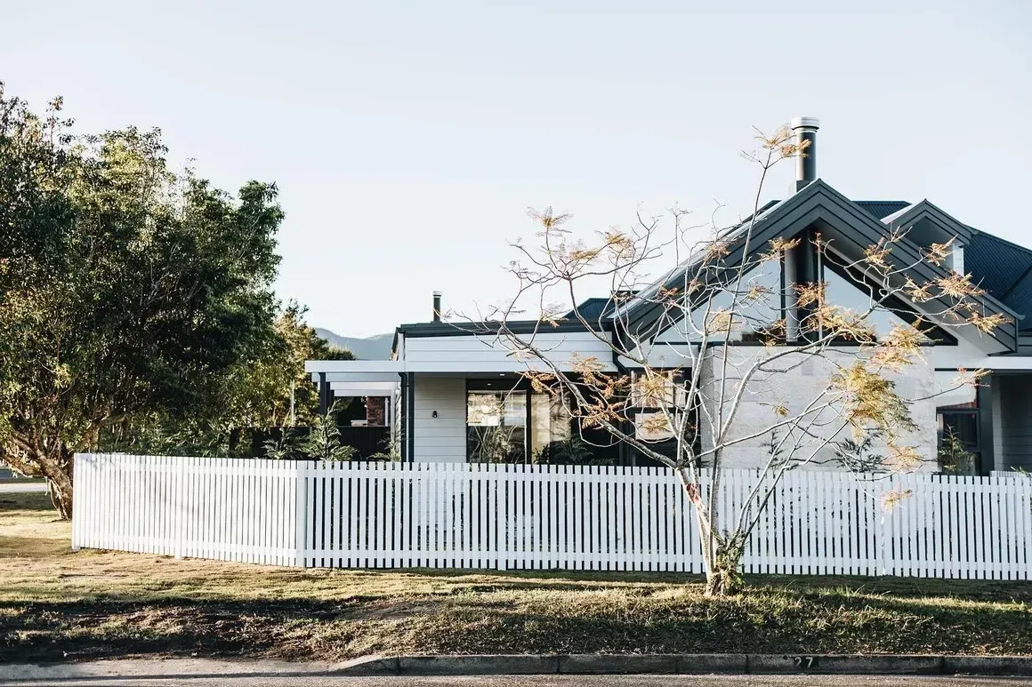 White House Behind a White Picket Fence, Sunny Day — Stark Building & Constructions In Berry, NSW