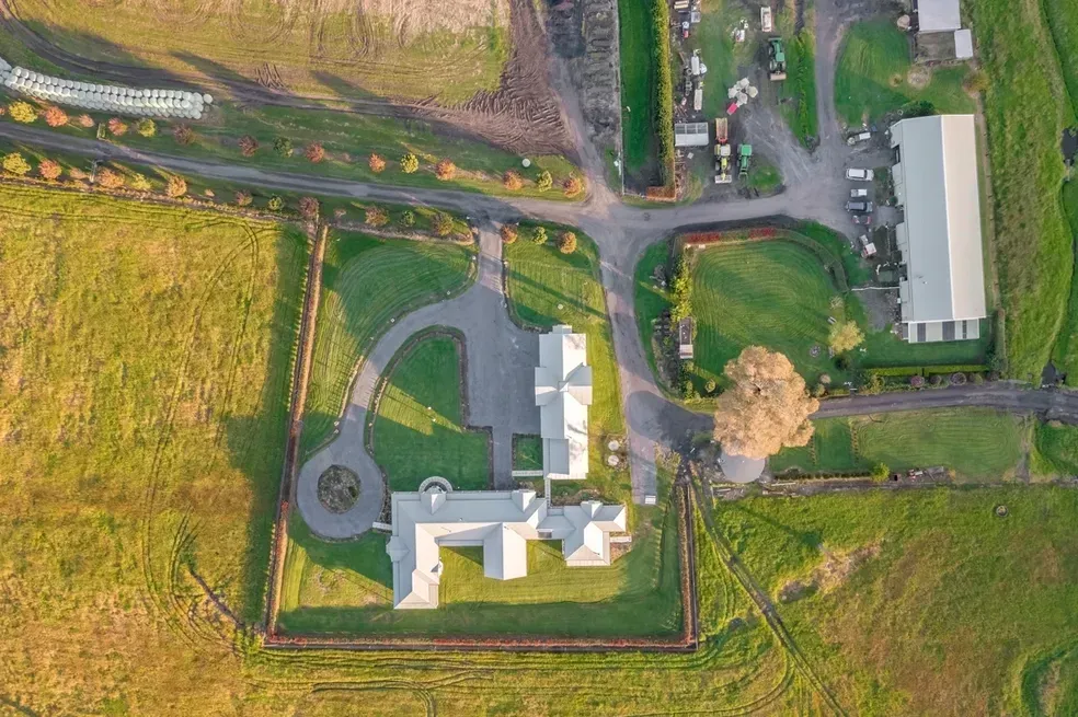 Aerial View of a White Mansion With a Long Driveway — Stark Building & Constructions In Berry, NSW
