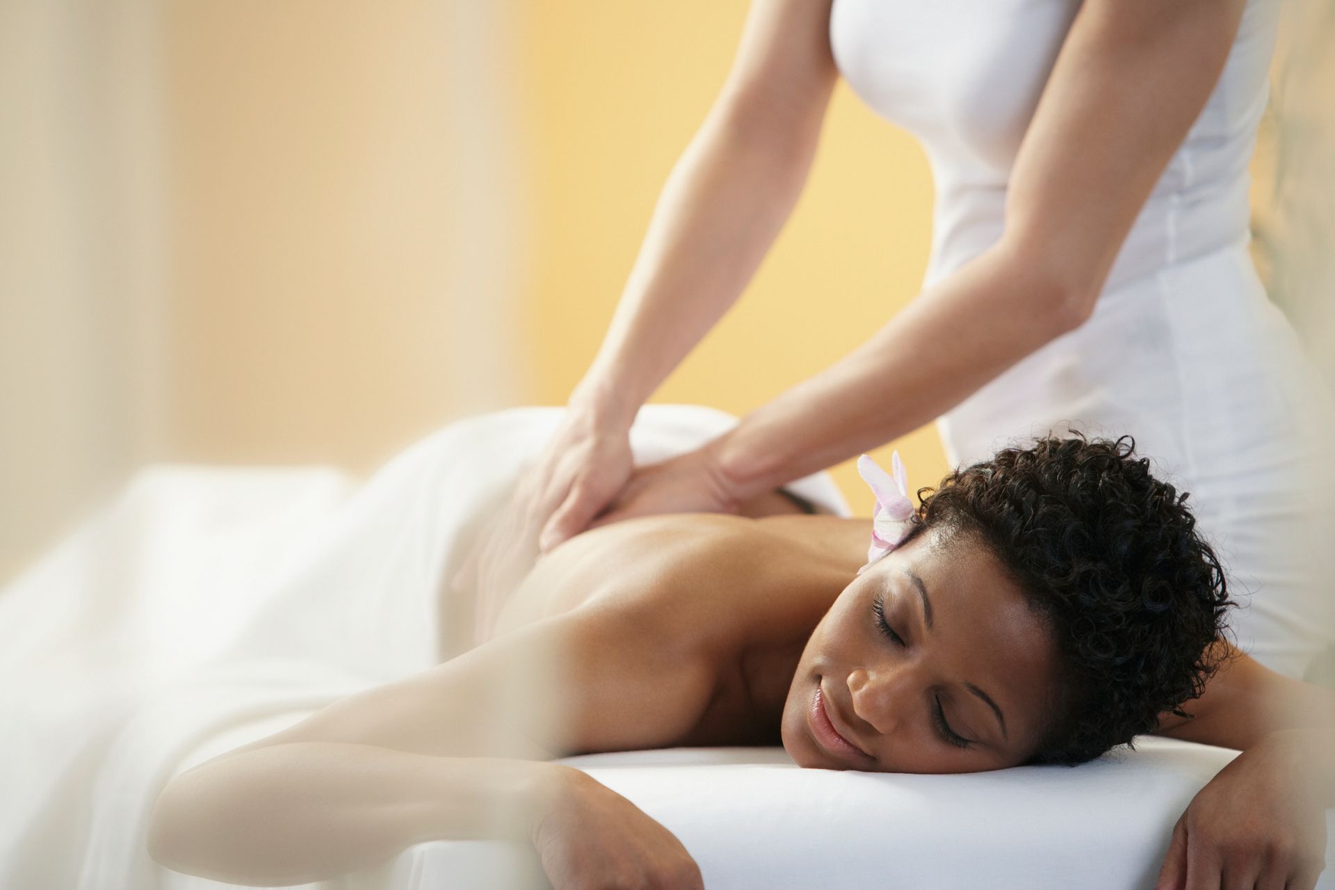 A Woman Is Laying on A Table Getting a Massage - Sumter, SC - K LCG Exclusive Med Spa