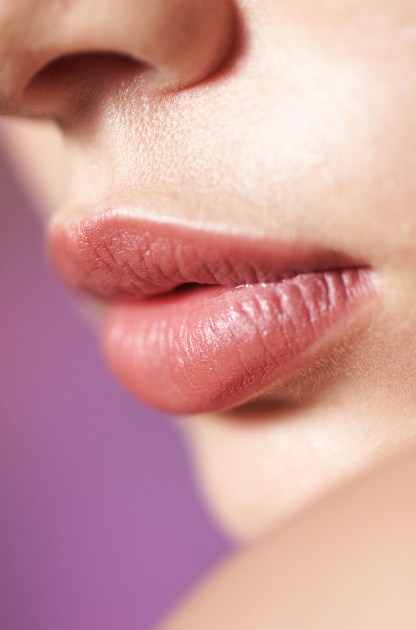 A Close up Of a Woman 's Lips and Nose on A Purple Background - Sumter, SC - K LCG Exclusive Med Spa