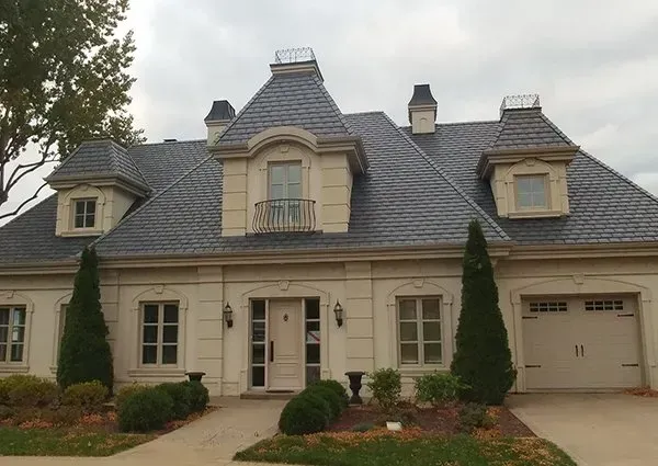 A large white house with a slate roof