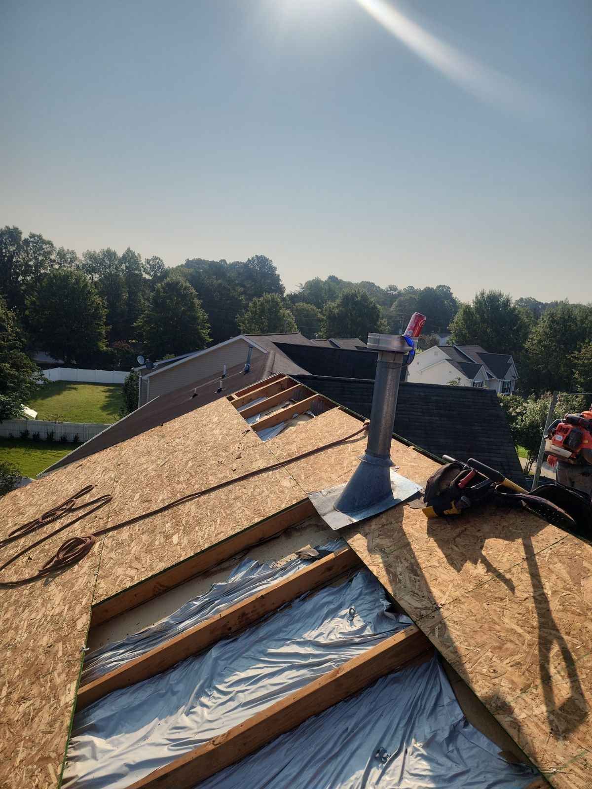 A roof with a chimney on it is being built.