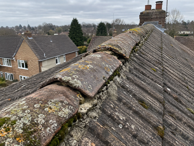 Loose ridge tiles with crumbling mortar