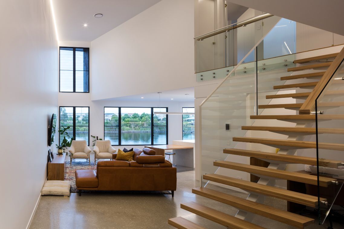 Spacious Living Room With Wooden Stairs — Architects In Mooloolabah, QLD