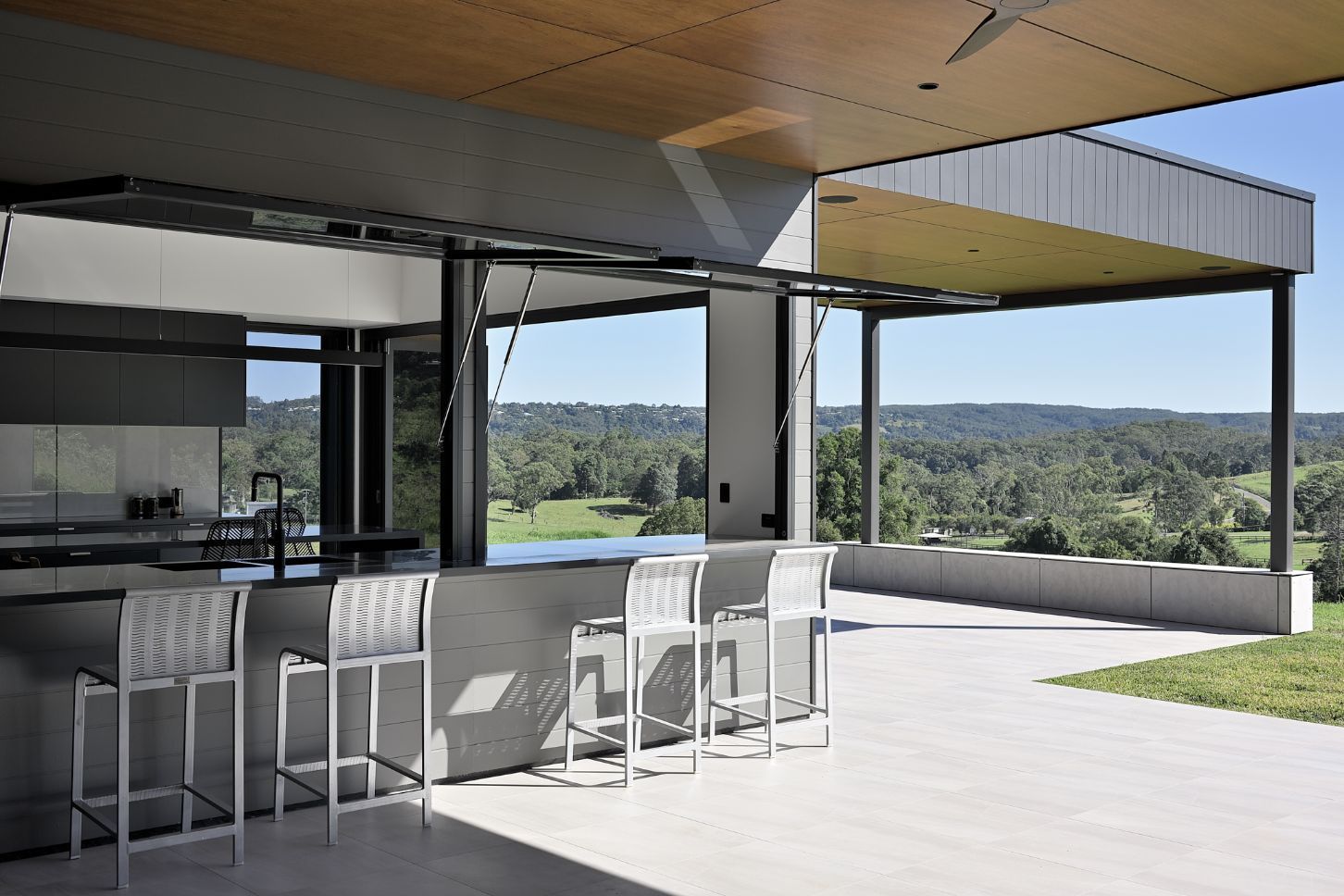 Open Kitchen With Empty Dinning Room Table And Chairs — Architects In Northern Rivers, QLD