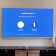 A blue TV screen shows two setup options: a circular icon for 