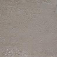 A close-up, top-down view of light gray, textured wallpaper with a subtle, repeating floral pattern.