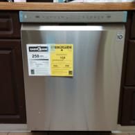 A stainless steel dishwasher with a yellow EnergyGuide label, installed between dark wood kitchen cabinets.