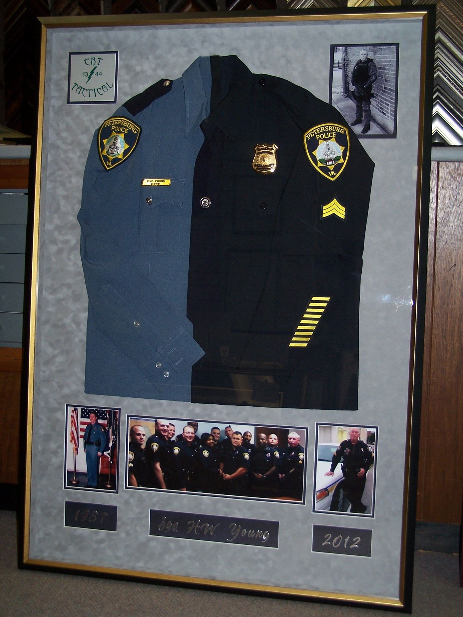 A framed picture of a police officer's uniform