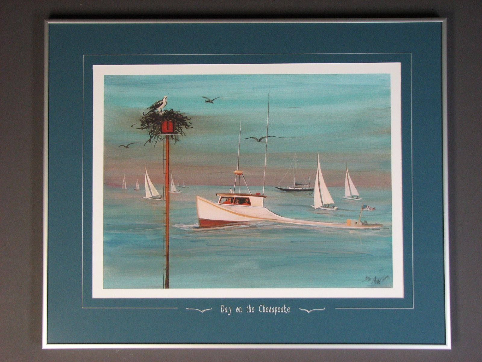 A framed painting of a boat in the ocean