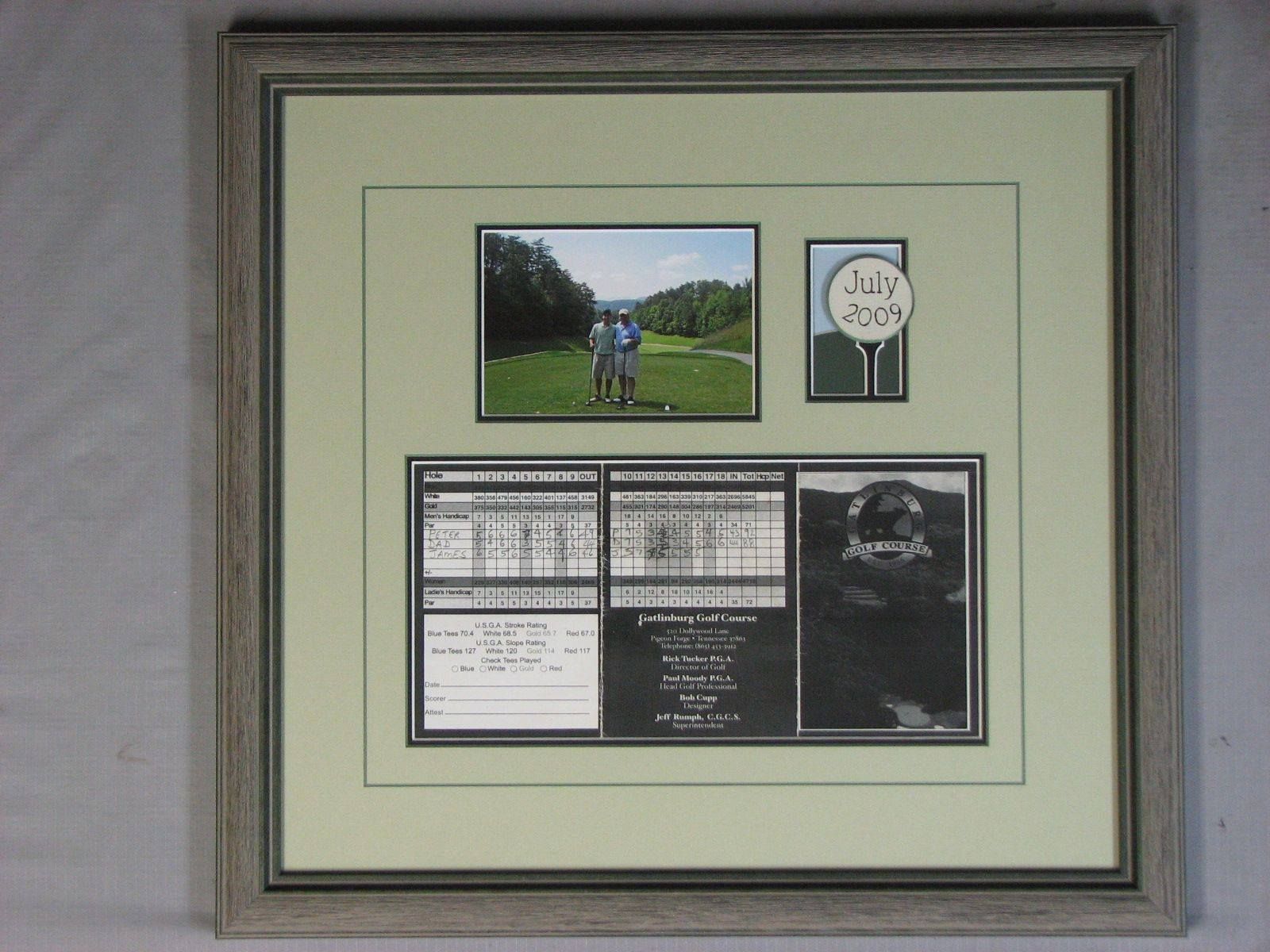 A framed picture of a couple standing on a golf course