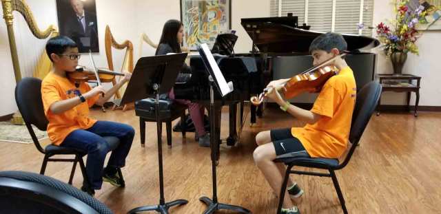 Two Boys Playing String Instrument — Cary, NC — Cary School of Music