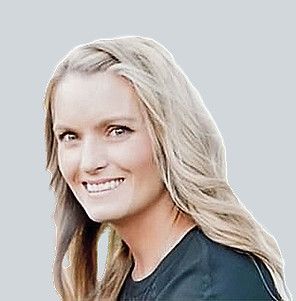 A headshot of a smiling person with long blonde hair against a plain light gray background.