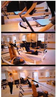 A Pilates class with people using reformers under instructor supervision in a bright, spacious studio.