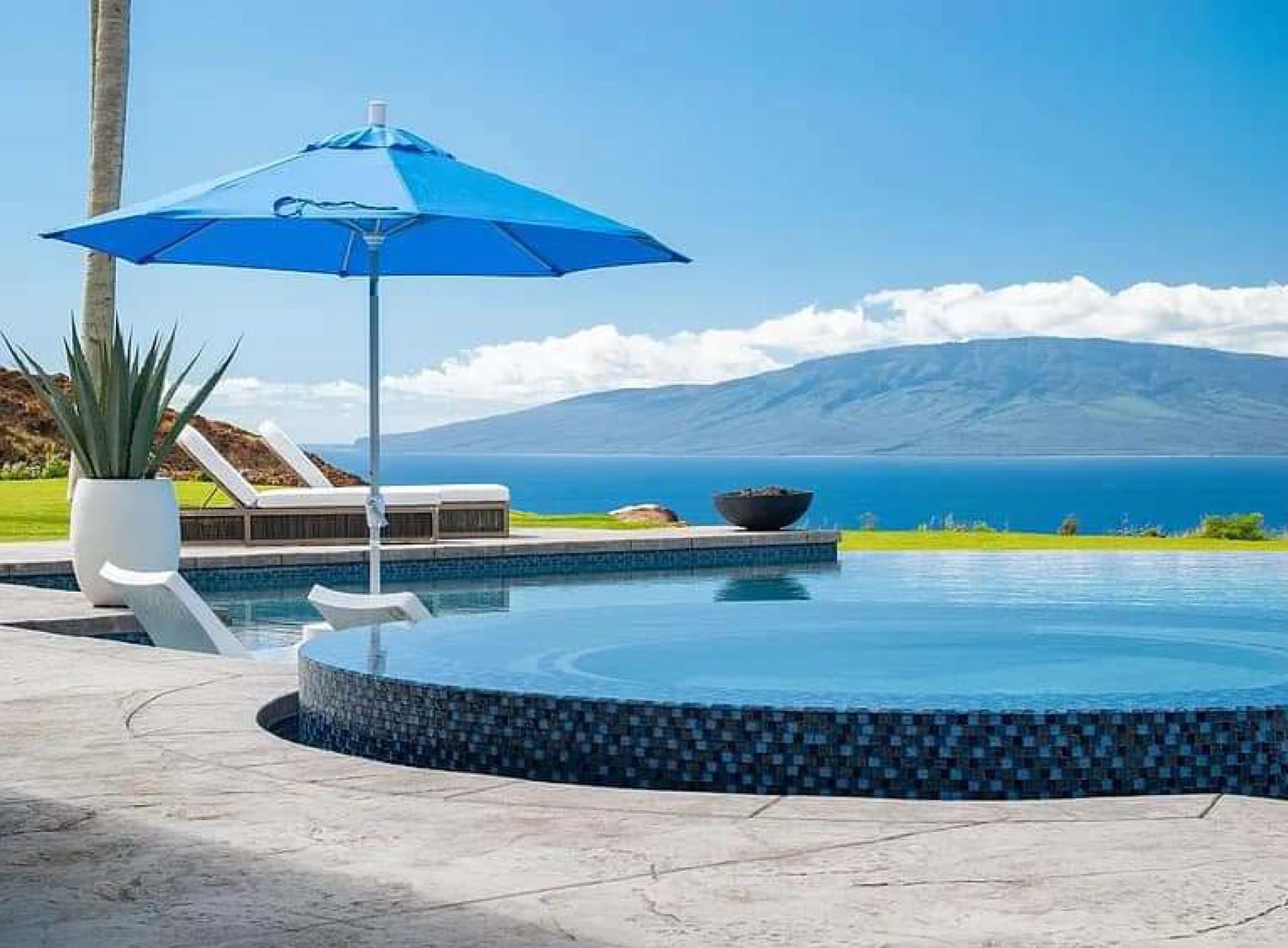 Close up of a swimming pool with stair showcasing exceptional swimming pool maintenance by Pool Pro, Inc. in Maui, HI.