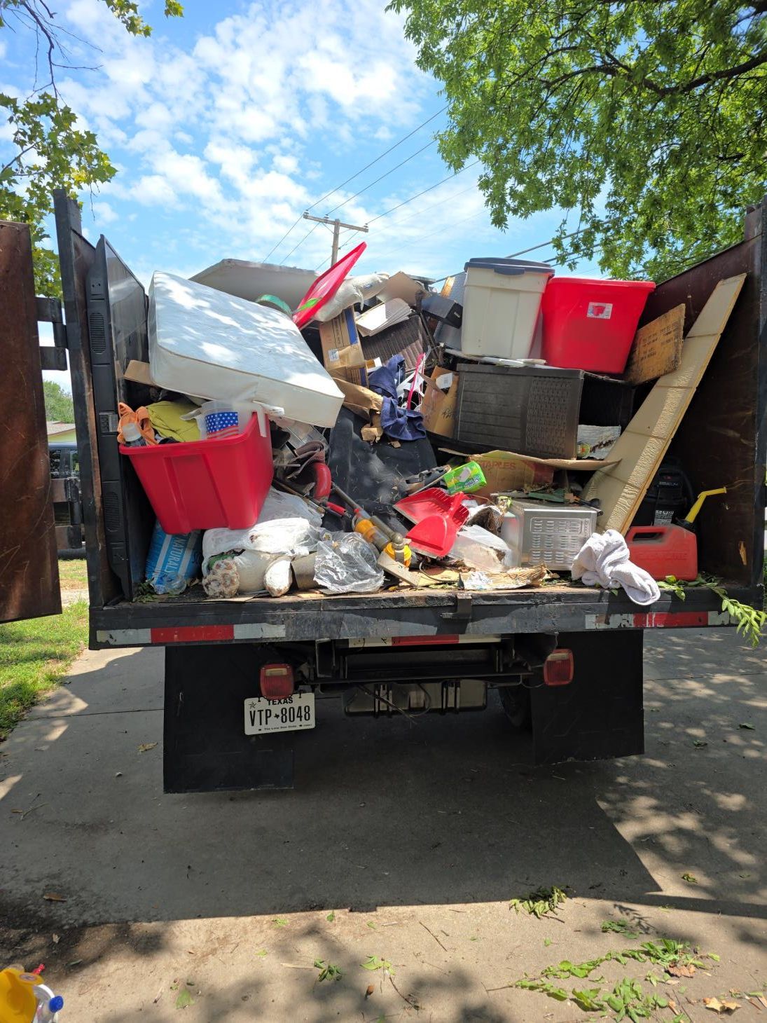 a construction worker is carrying a bag of concrete in a room .