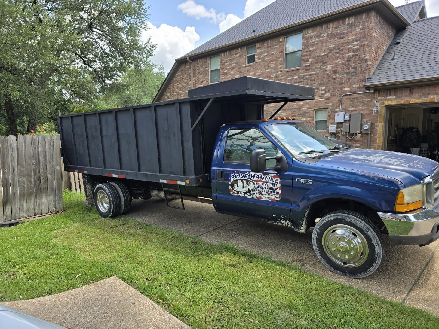 a house with a lot of trash in front of it .