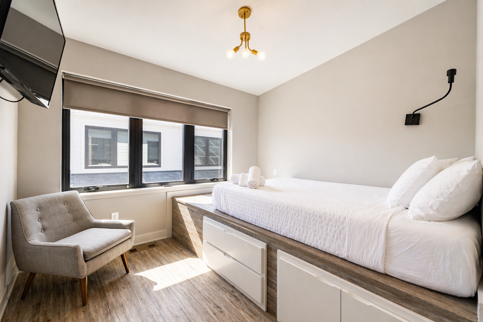 Private queen bedroom with ensuite bath at Stadium Suites near Michigan Stadium