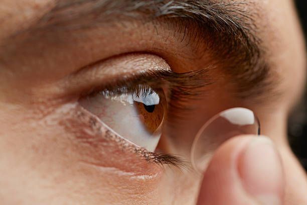 A Close Up Of A Person Putting A Contact Lens In Their Eye - Cheyenne, WY - Family Vision Center