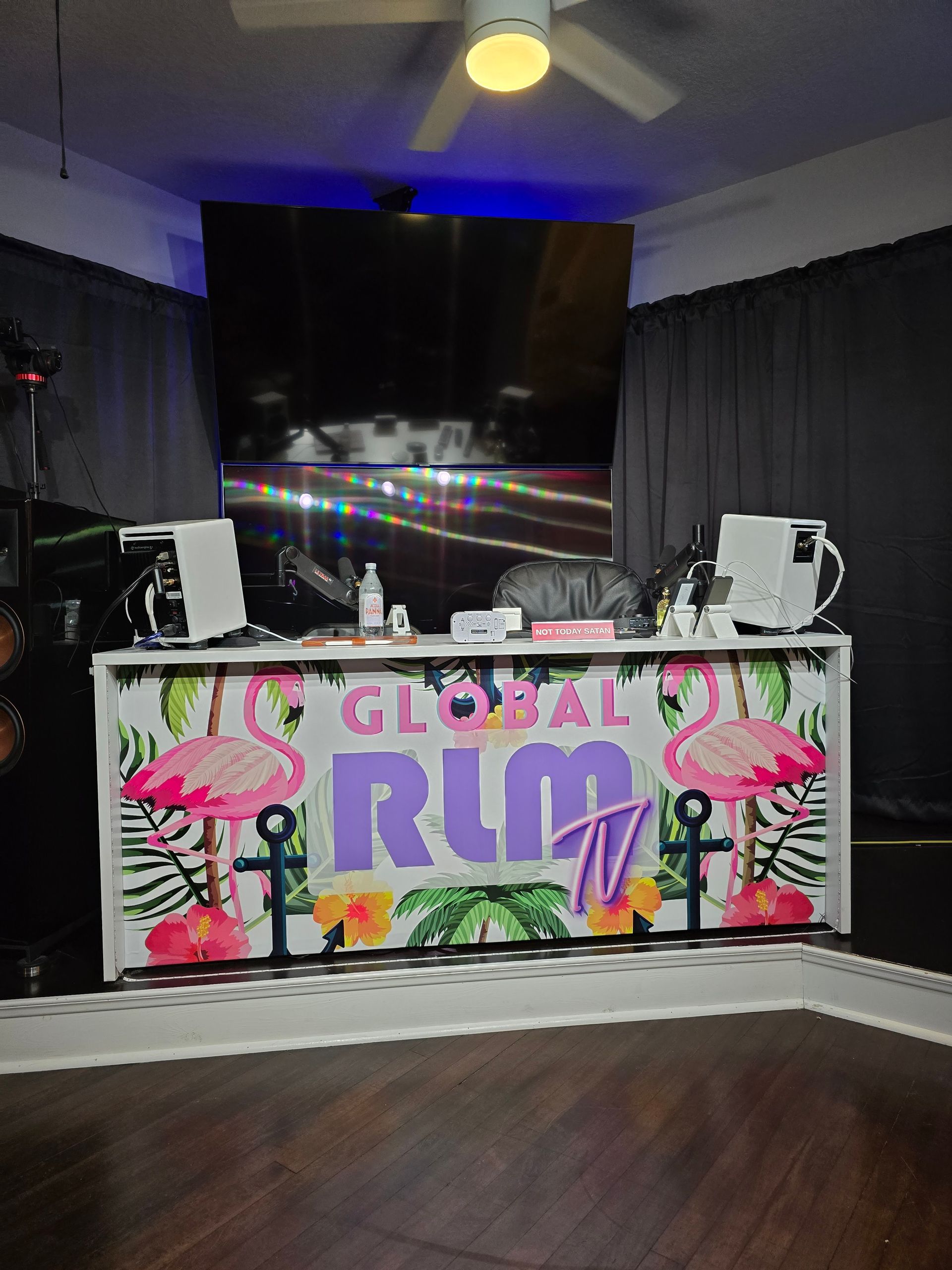 A room with a sign that says global rlm tv