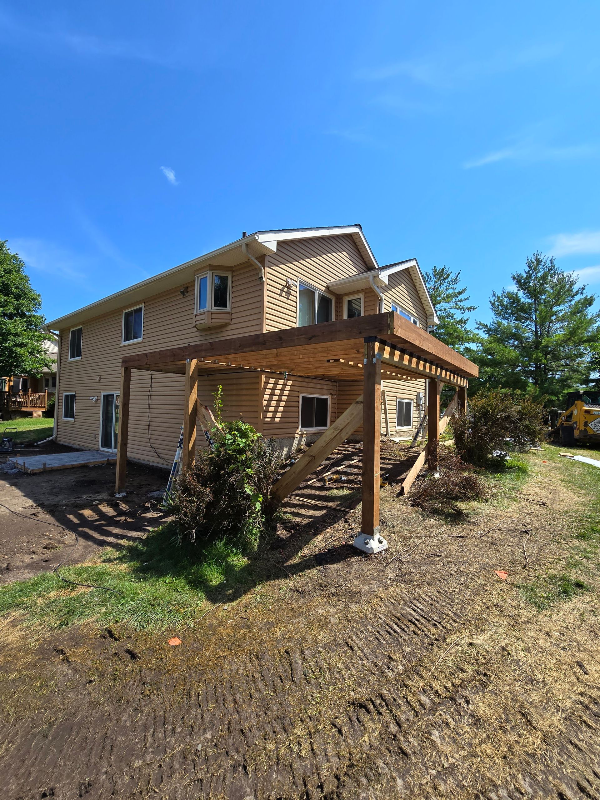 A house with a pergola on the side of it