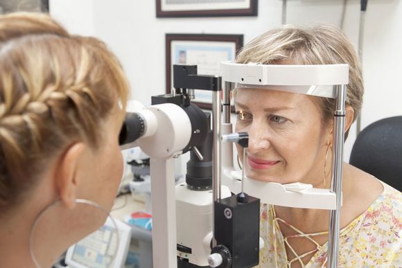 Optometrist completing eye exam