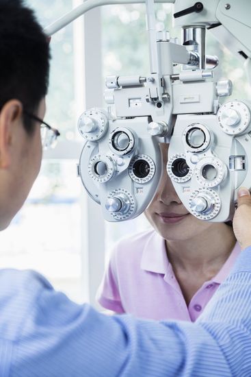 optometrist completing an eye exam