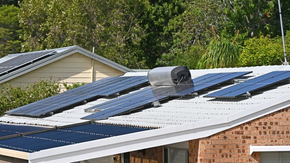 A row of solar panels on the roof of a house — J T Walker Electrical In Gloucester, NSW