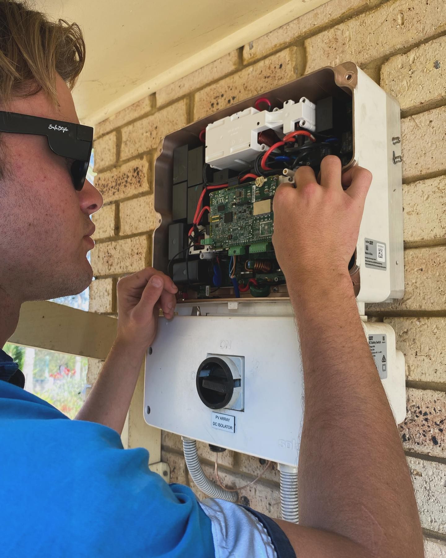 A Man is Working on a Electric Outage — J T Walker Electrical In Gloucester, NSW